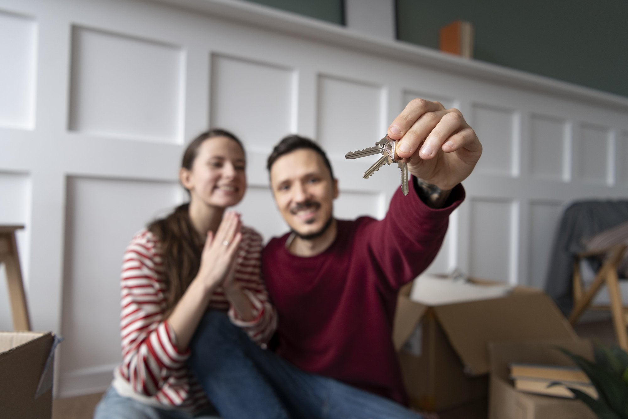 young-family-moving-into-new-home-min